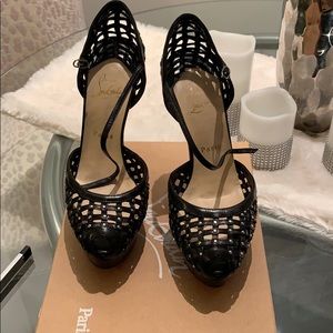 Never worn Christian Louboutin platform pumps